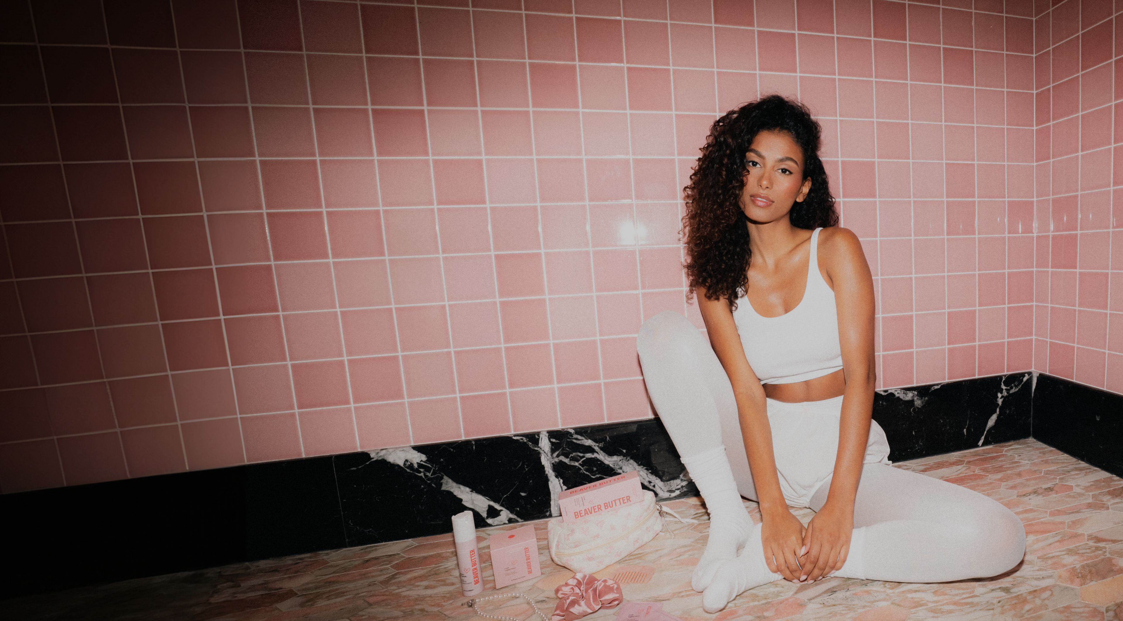 woman sitting with intimate care products